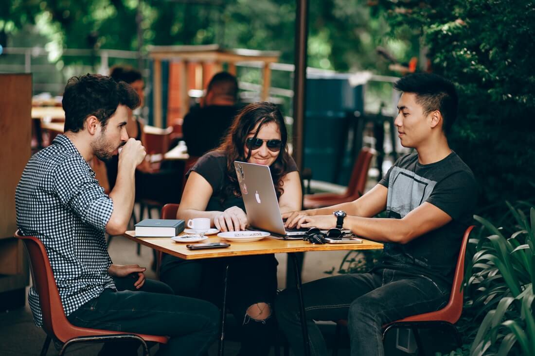 A group of people working in a cafe